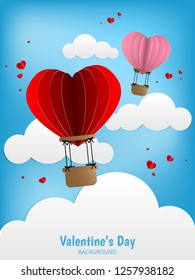 A couple of hot air balloons in a heart shape float on blue sky with white clouds background. Concept of love and Valentines day, paper art style. Vector illustration.