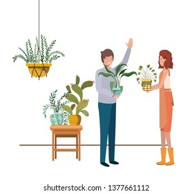 couple with houseplant on macrame hangers