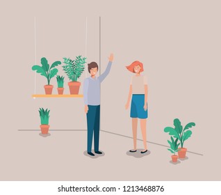 couple with houseplants in shelf
