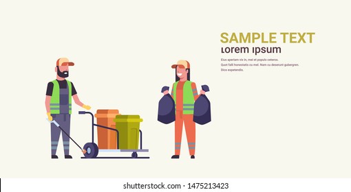 couple janitors team gathering trash man cleaner pushing trolley cart with rubbish bins woman holding black rubbish bags cleaning service concept flat horizontal copy space full length