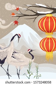 Couple of japanese cranes and lanterns.  Winter asian landscape