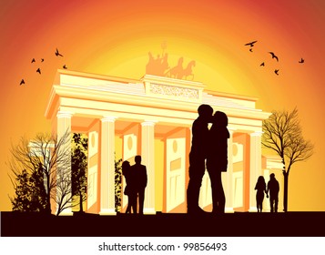 couple kissing in the background of Brandenburg Gate