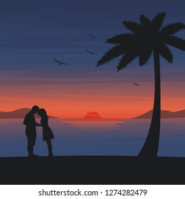 Couple are kissing on the beach with romantic sunset background