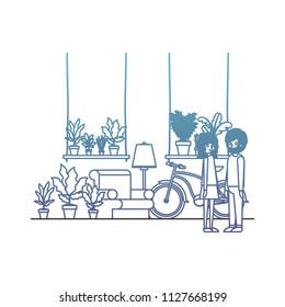 couple in the livingroom with houseplants and bicycle