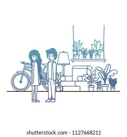 couple in the livingroom with houseplants and bicycle