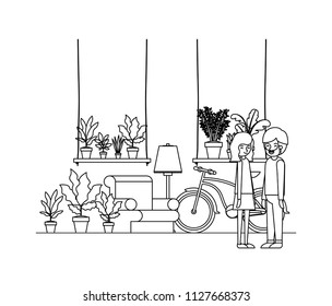 couple in the livingroom with houseplants and bicycle