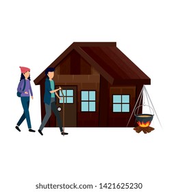 Couple With Log Cabin With Wood Fire