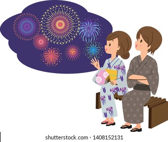 Couple looking up at night sky fireworks