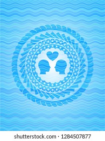 couple in love icon inside light blue water wave emblem background.
