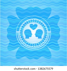 couple in love icon inside light blue water wave emblem.