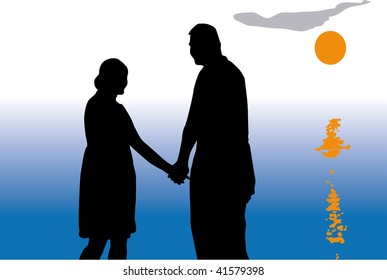 Couple in love on the beach while sunset.