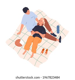 Couple in love on a picnic lying on a blanket