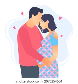 Couple in love. Pregnant woman with her husband. Loving couple hugging isolated on white background.
