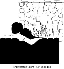 a couple in love is sitting at home near the fireplace in an embrace