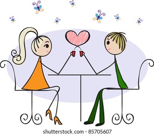 Couple in love sitting at a table in a cafe and drink hot coffee
