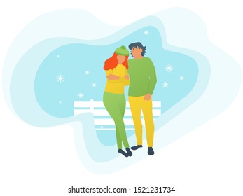 couple in love is talking in the winter by the bench