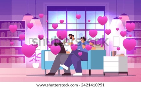 couple in love using laptop man woman lovers relaxing on sofa social media network valentines day celebration concept