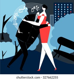 Couple of lovers dancing in the park at night listening to music on their mobile phone.