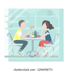 Couple of lovers in a café. Romantic date. Cozy table by the window. Congratulations on Valentines Day. 