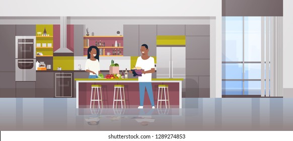 couple making dinner happy african american man woman cooking together at home modern kitchen interior male female cartoon characters full length horizontal flat