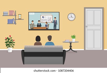 Couple of man and woman watching tv in living room interior. Family relax on sofa in front of the tv set. Domestic situation.