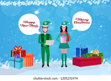 couple man woman wearing elf costume chat bubble happy new year merry christmas concept gift boxes decoration flat horizontal banner vector illustration
