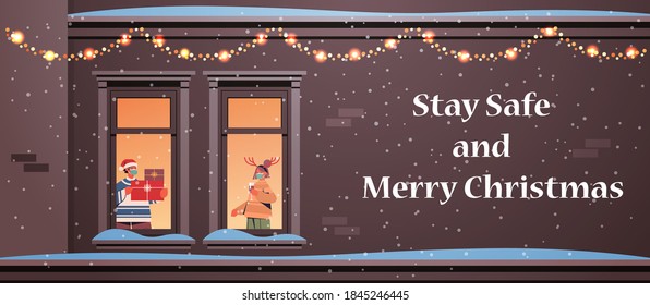 couple in masks holding gifts man woman standing in window frames new year christmas holidays celebration self isolation concept building house facade horizontal vector illustration