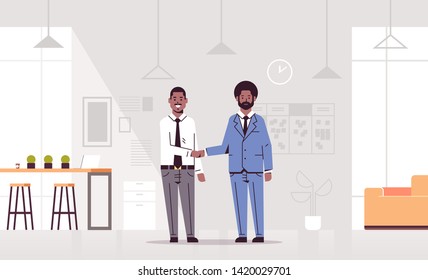 couple men handshaking african american business partners hand shake during meeting agreement partnership concept co-working center modern office interior flat full length horizontal