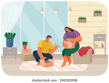 Couple moving to new house or apartment. Man and woman packing their stuff in cardboard boxes