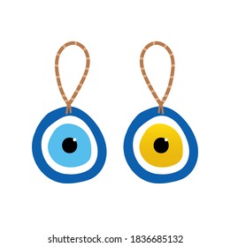 Couple of nazar amulets, evil eye protection talismans on rope. Turkish blue eye-shaped amulets. 
