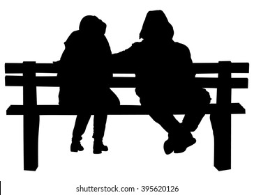 Couple on a bench - Two lovers sitting on a bench in a park and holding themselves by hands - Concepts of autumn,love,togetherness,relationship. Romantic Couple on a Bench.