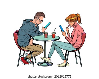 a couple on a date in a restaurant are looking at smartphones and not talking, loneliness and new technologies