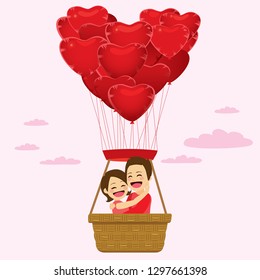 Couple on Saint Valentine day riding on heart shape balloons