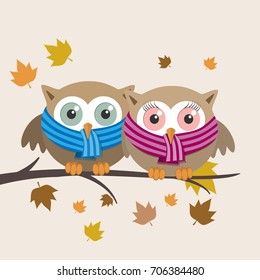 Couple of owls with scarf on a fall day