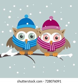 Couple of owls with scarf on a winter day