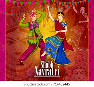 Couple performing Garba dance in Dandiya Raas for Dussehra or Navratri in vector