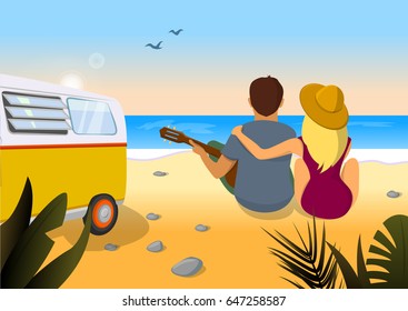 Couple playing guitar on the beach. Hugging couple sitting on the beach with guitar. Romantic dating by the sea.