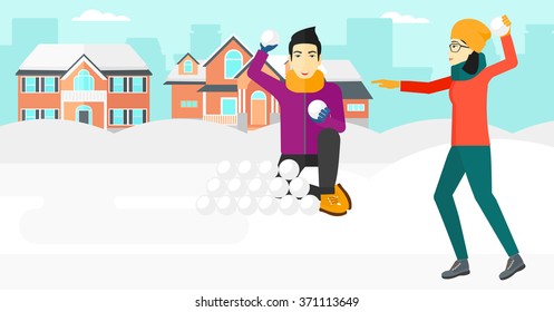 Couple playing in snowballs.