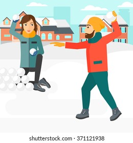 Couple playing in snowballs.