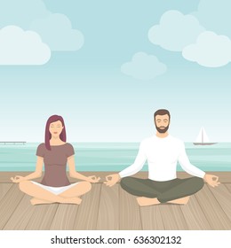 Couple practicing meditation outdoors, they are sitting in the lotus position next to the sea, yoga and self consciousness concept