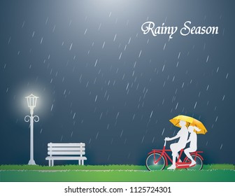 Couple riding a red bike on green grass in the rainy season ,paper craft style
