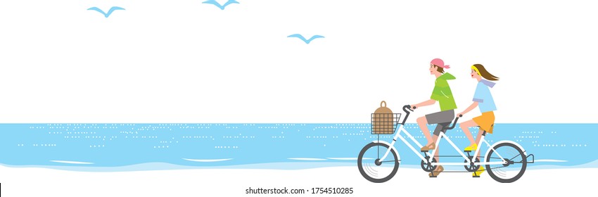 Couple riding a tandem bicycle at the seaside