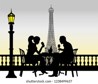couple romping in the evening at the Eiffel Tower in Paris