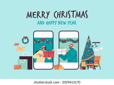 couple in santa hats presenting gifts to each other on smartphone screens people celebrating new year christmas holidays