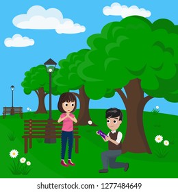 A Couple Share a Gift in Park