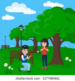A Couple Share a Gift in Park