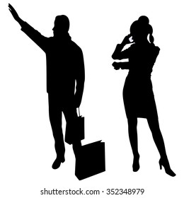  couple with shopping bags calling a Cab