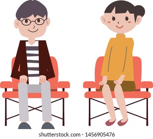 Couple sit in a chair