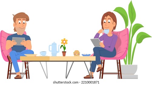 Couple sit at coffee table with gadgets. Modern lifestyle
