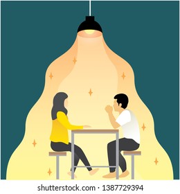 A couple sit in the corner or the cafe under the light of beautifull lamp and make a conversation about their relationship